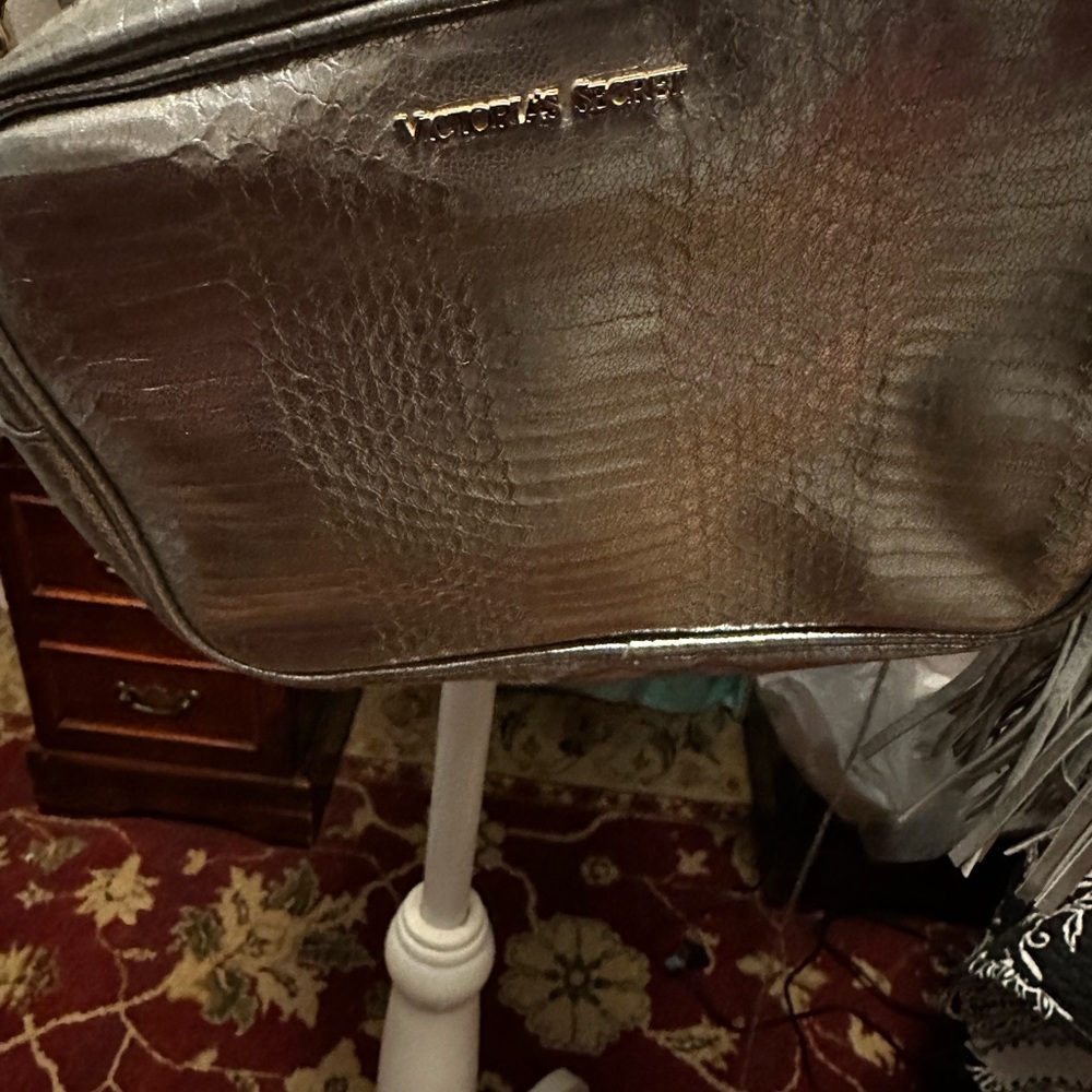 Silver Victoria Secret small shoulder bag with gold chain and fringe key chain